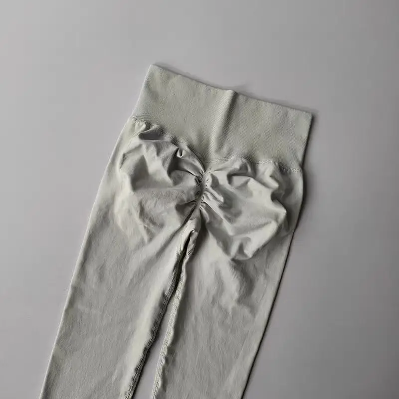 Bezszwowe legginsy do jogi push up z wysokim stanem Morelowy
