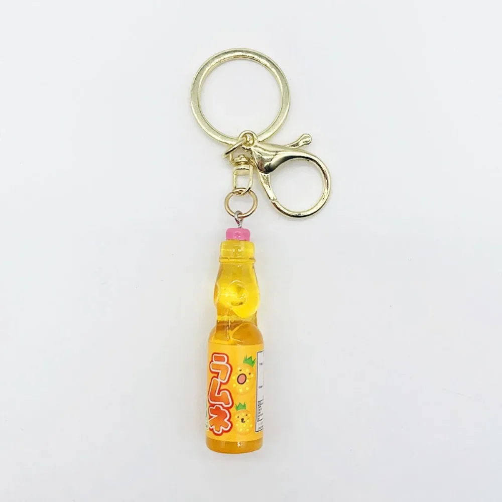 Breloczek japońska sodówka Ramune — miniaturowy wisiorek do torby Czarny