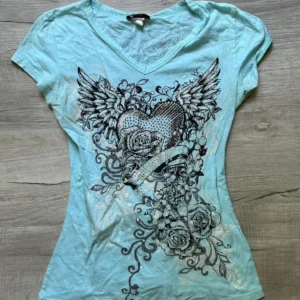 Crop top Y2K vintage z nadrukiem kwiatów i skrzydeł — grunge gothic Beżowy
