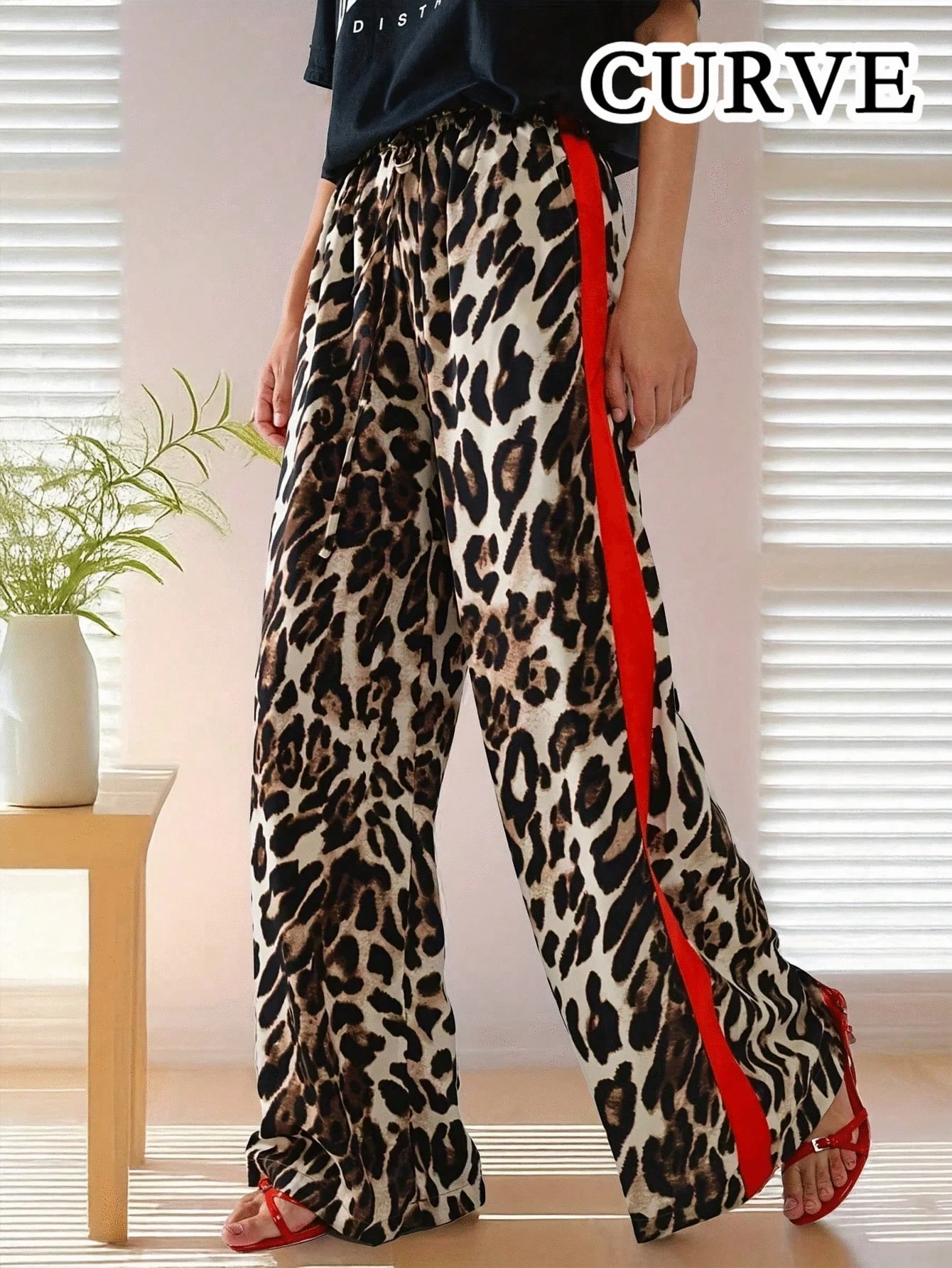 Damskie spodnie plus size w panterkę z lampasami Wielo