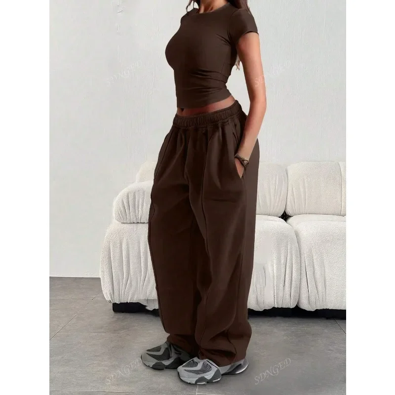 Damskie spodnie sportowe plus size z szerokimi nogawkami Brązowy