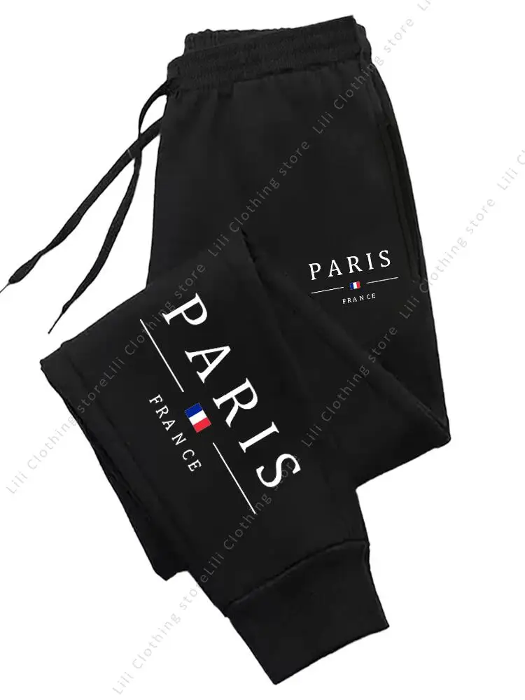 Dresowe spodnie joggery damskie z nadrukiem Paris Czarny