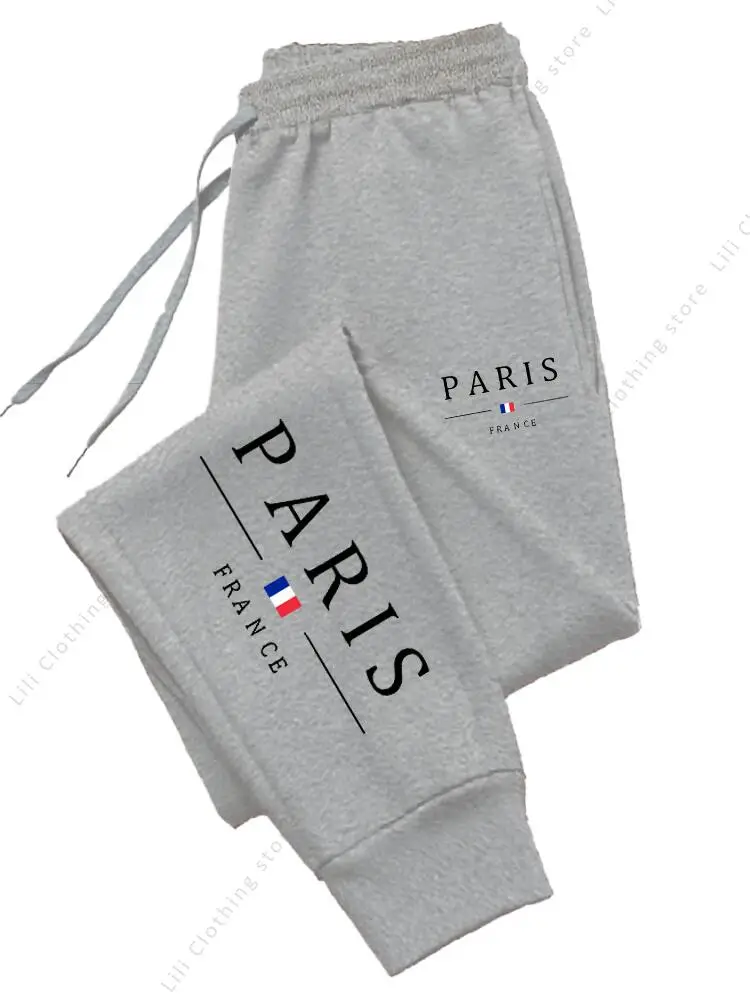 Dresowe spodnie joggery damskie z nadrukiem Paris Light gray01