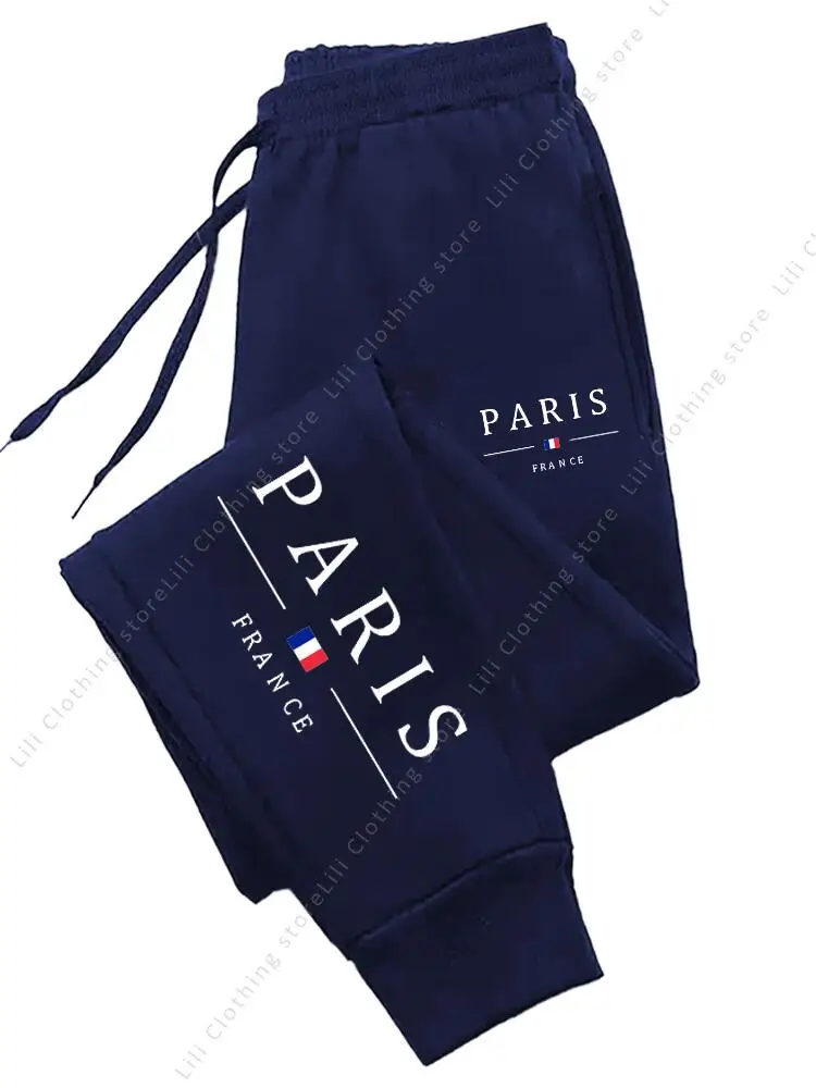 Dresowe spodnie joggery damskie z nadrukiem Paris Granatowy