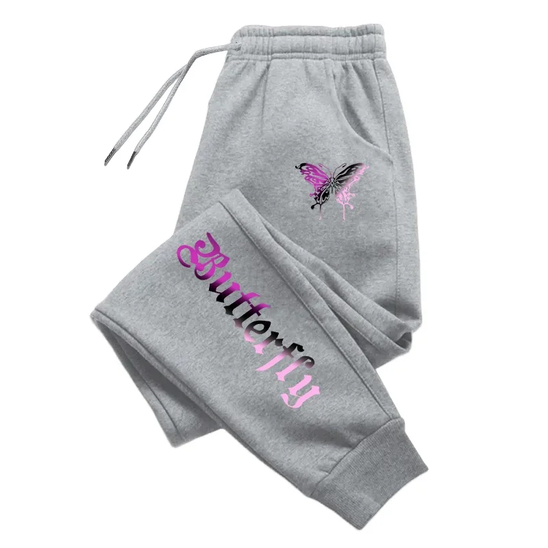 Dresowe spodnie joggery z literowym nadrukiem — streetwear na co dzień Szary