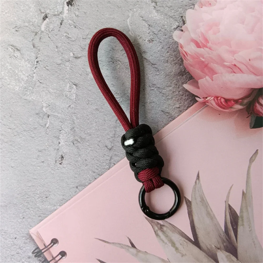 Kolorowy pleciony pasek na nadgarstek z breloczkiem — unisex paracord Pomarańczowy