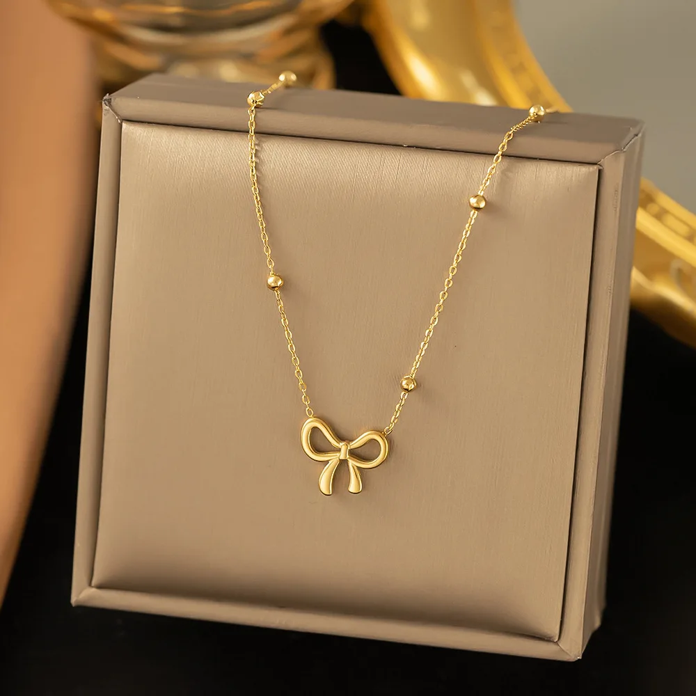Komplet biżuterii ze stali szlachetnej z kokardką — naszyjnik, bransoletka, kolczyki Dg4241 necklace