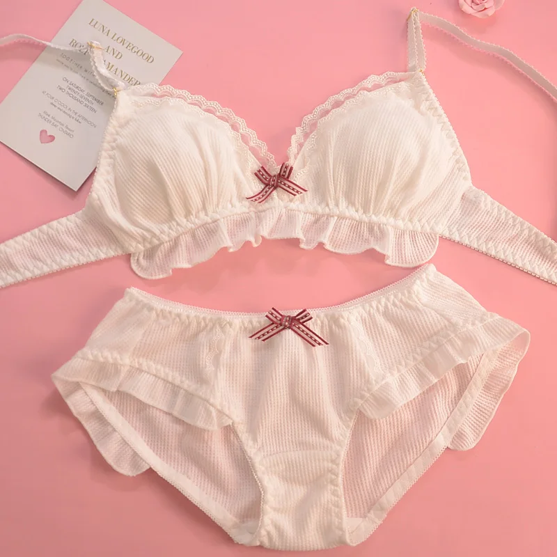 Koronkowy komplet bielizny push-up z kokardką i stringami 7