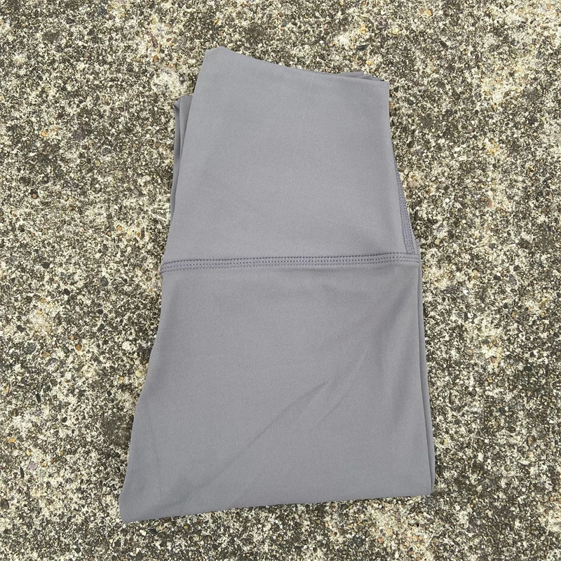 Legginsy sportowe z kieszeniami plus size do biegania i fitnessu Piaskowiec