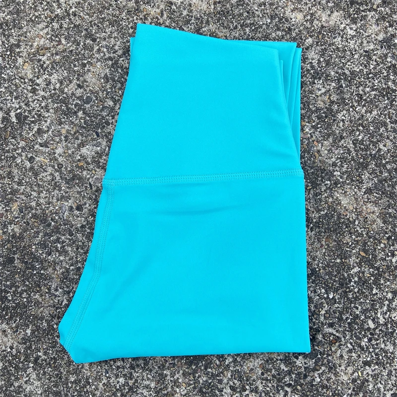 Legginsy sportowe z kieszeniami plus size do biegania i fitnessu żółte algi