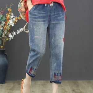 Luźne jeansy z haftem i przetarciami w stylu vintage Niebieski