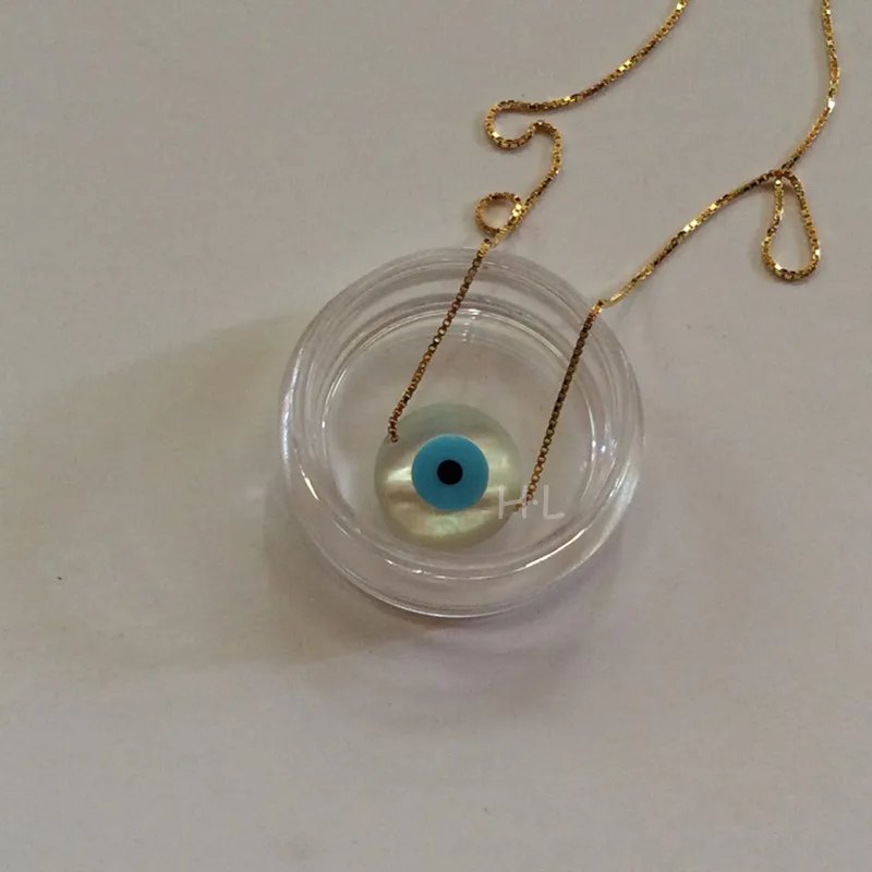 Naszyjnik choker z zawieszką z muszli MOP kocie oko żółty