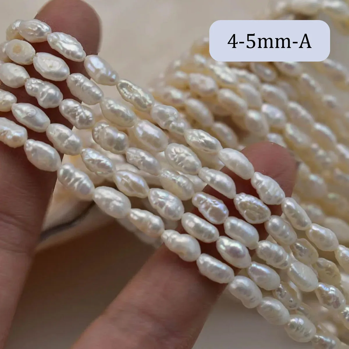 Naturalne perły słodkowodne barokowe pasiaste 4–5 mm do biżuterii Biały