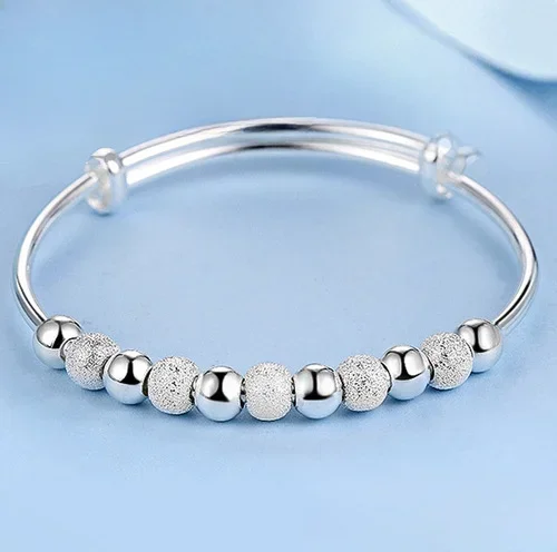 Regulowana bransoletka bangle z charmsem, posrebrzana Srebrny