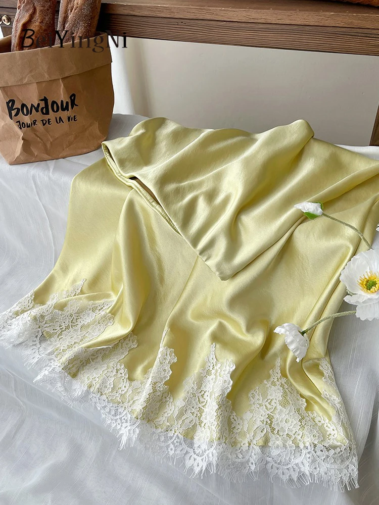 Satynowa spódnica midi syrenka z koronką elegancka biurowa żółty