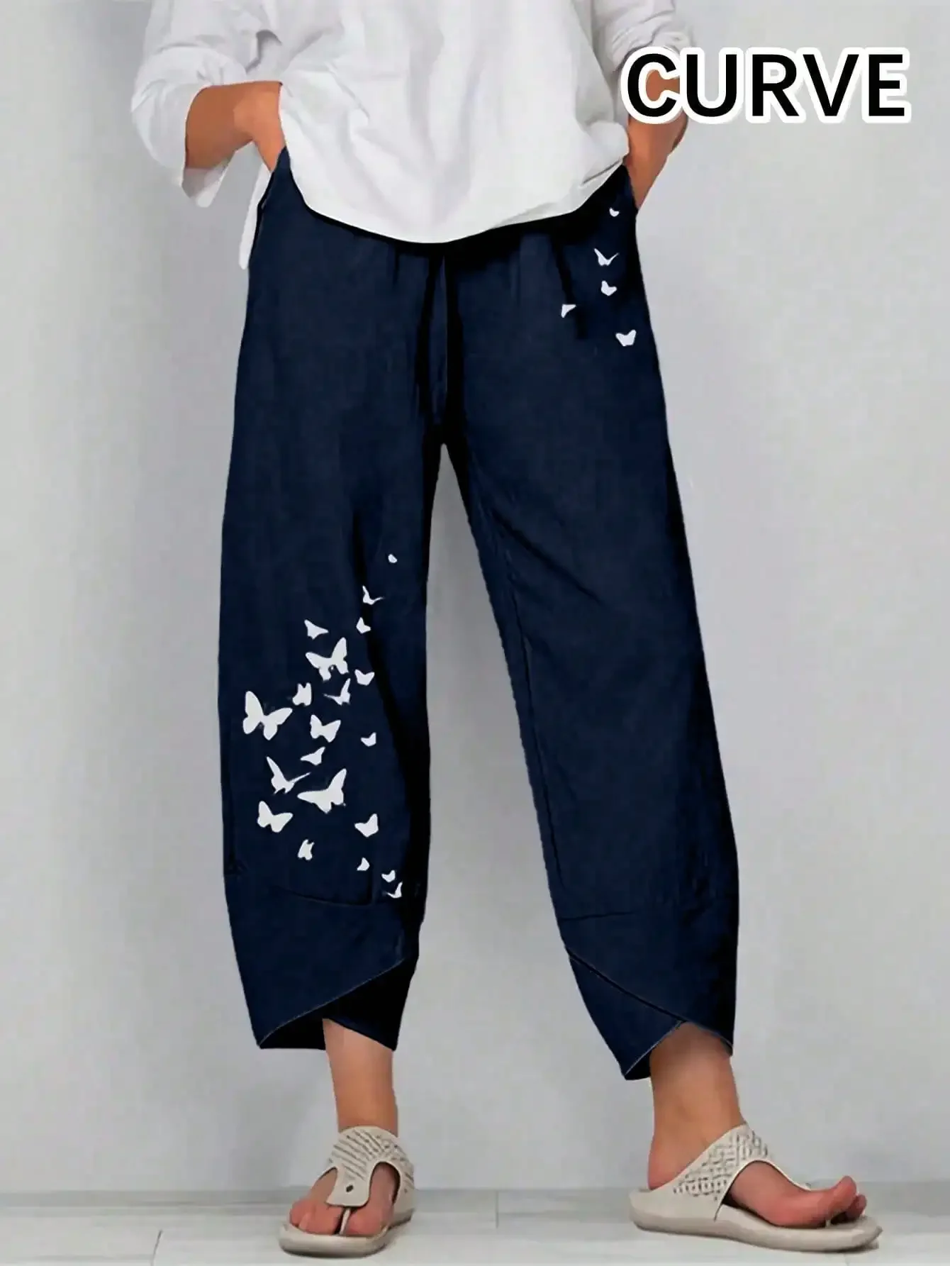 Spodnie damskie plus size z motylkami i gumka w pasie Granatowy